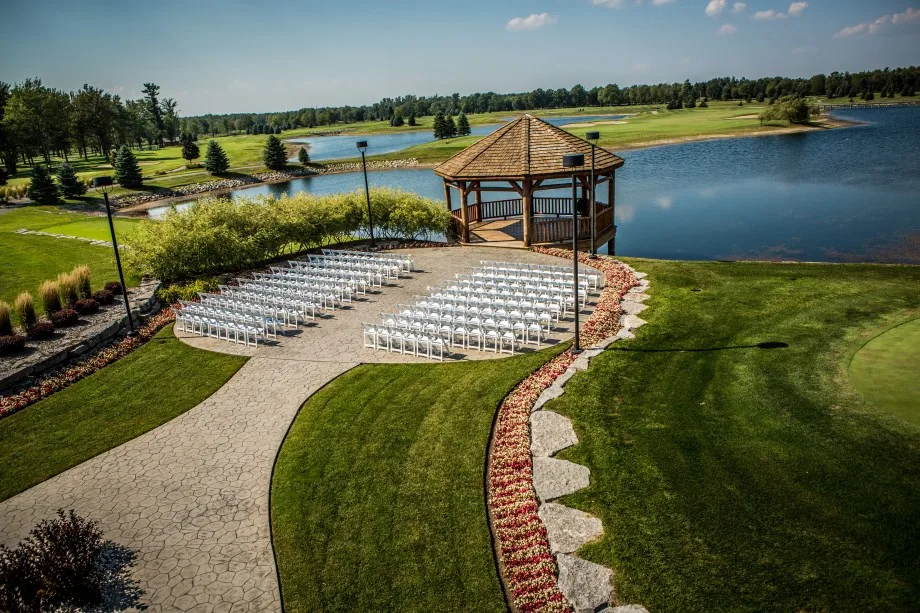 Aerial view of the waterfront ceremony gazebo and seating at Solitude Links