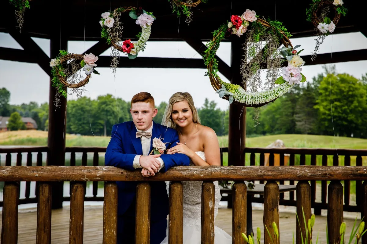 Bride and groom portrait inside the Solitude Links wedding gazebo